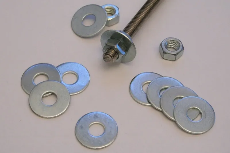 Flat washers, hex nuts and a threaded rod